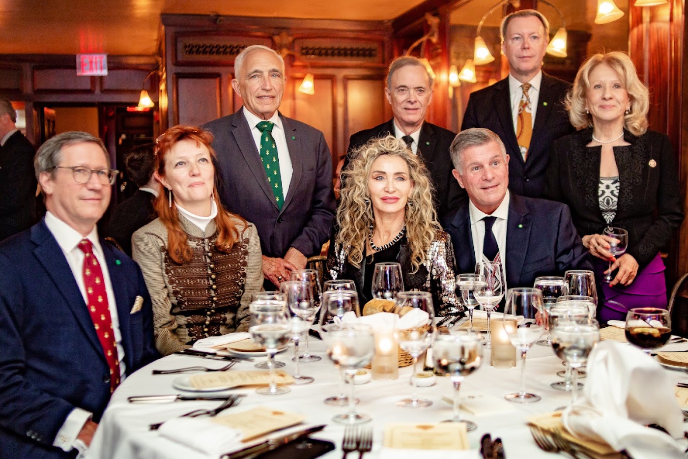 Guests at a formal gala dinner in a wood-paneled Manhattan dining room, corporate event by Josh Mak Photography