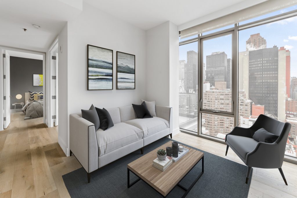 Virtually staged living room with gray sofa and Midtown Manhattan tower views, by Josh Mak Photography